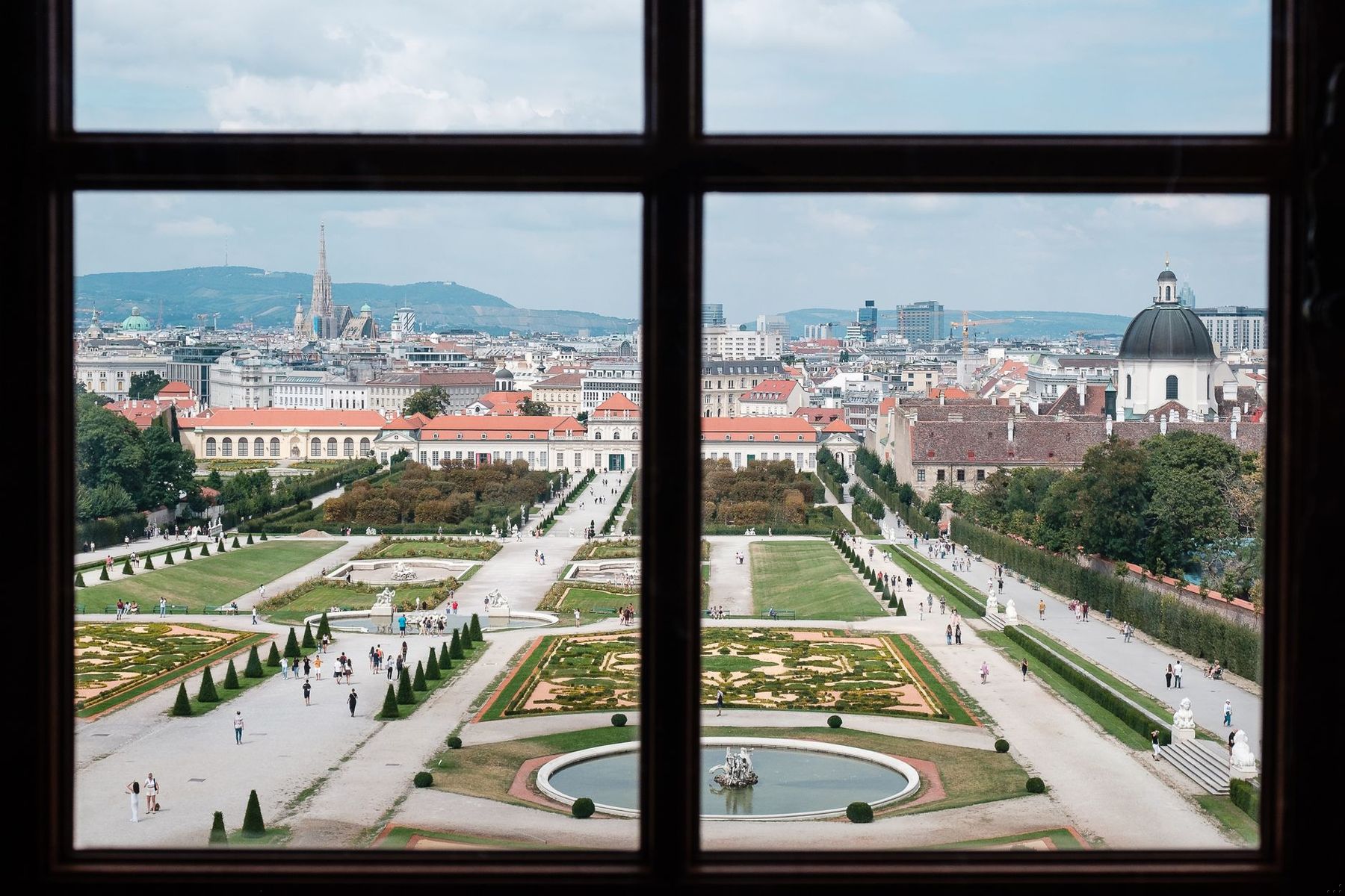 Upper Belvedere: the garden and the city through a window of the Upper Belvedere