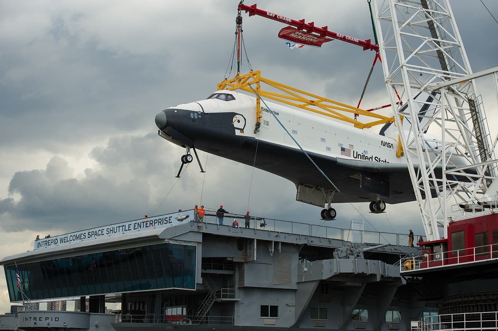 Intrepid Museum: Enterprise lifted by crane onto the flight deck, June 6, 2012