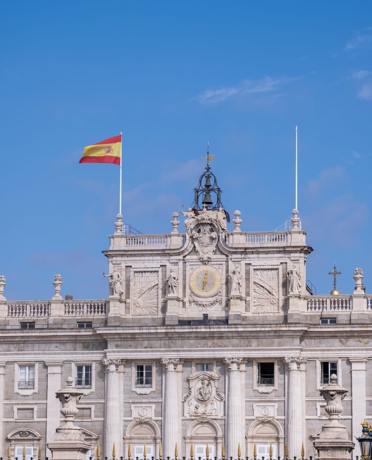 Royal Palace of Madrid: the clock and the flag over the centre of the south front