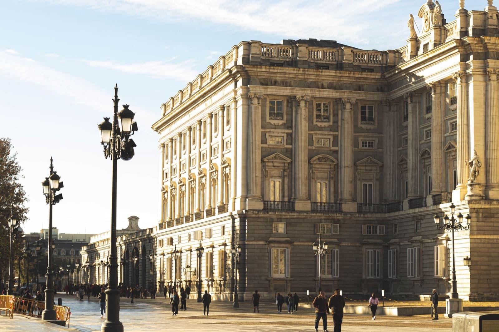 Royal Palace of Madrid: a corner of the palace in the late sun, with the street lamps