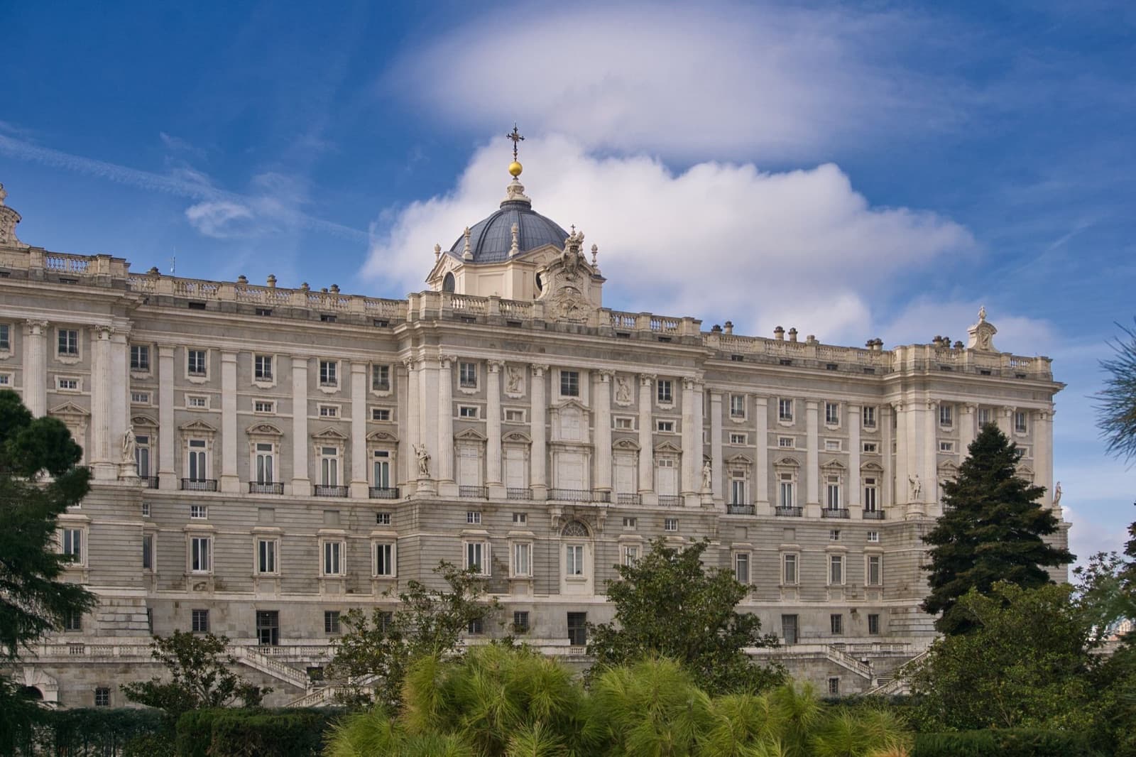 Royal Palace of Madrid: the palace and the chapel dome above the trees of the Sabatini Gardens