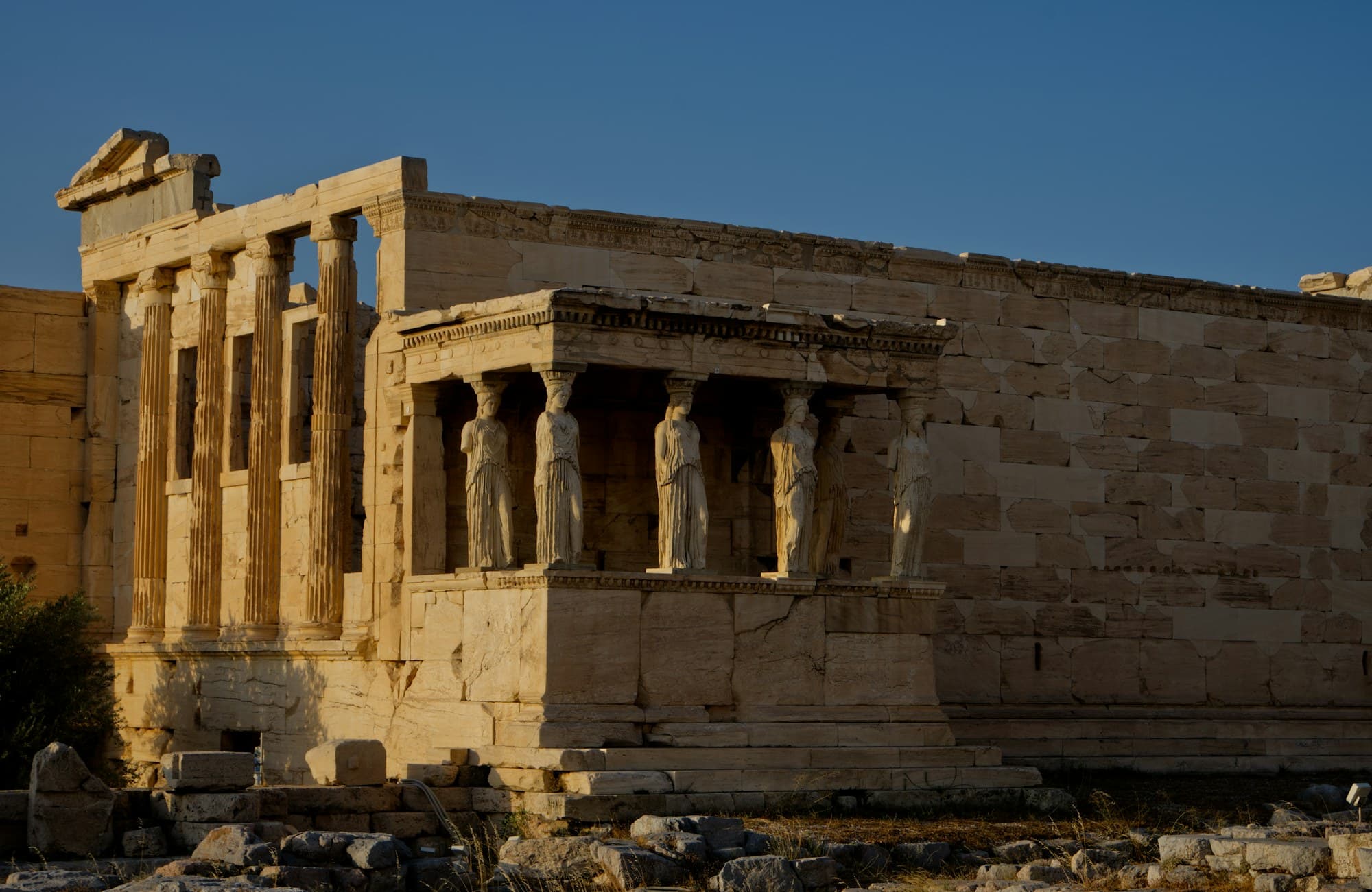 Acropolis Museum: the Porch of the Caryatids on the Erechtheion at sunset; the figures on the temple are copies, the originals are in the museum
