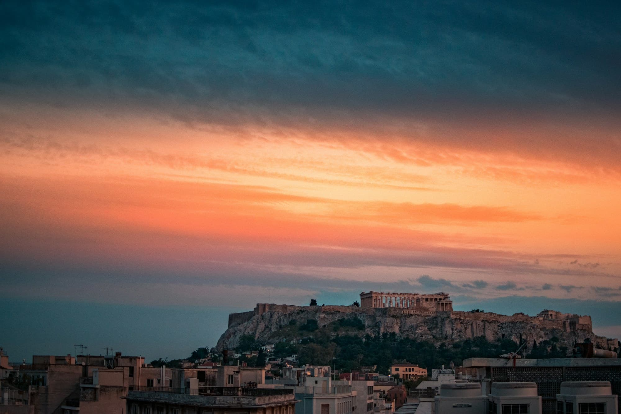 Acropolis Museum: the Acropolis above the city's rooftops at sunset