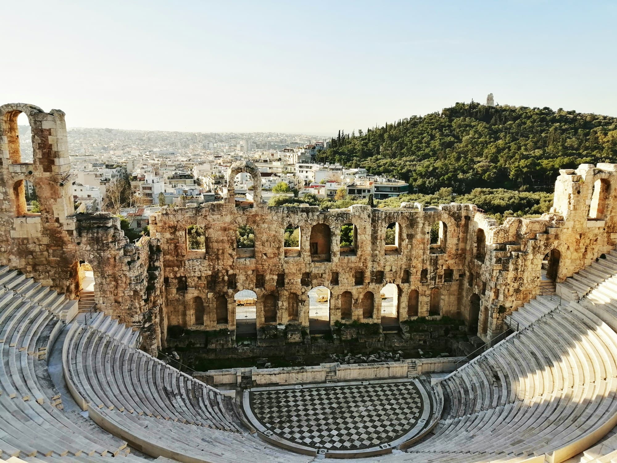 Acropolis Museum: the Odeon of Herodes Atticus on the south slope, with Filopappou Hill behind