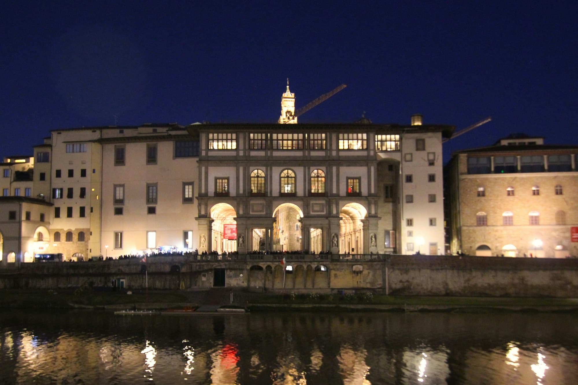 Uffizi Gallery: the Uffizi's river front lit at night, across the Arno