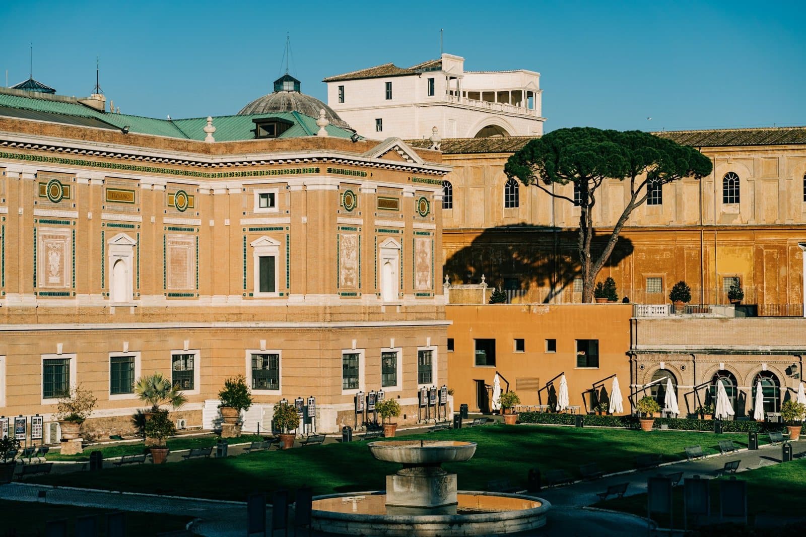 Vatican Museums: the Pinacoteca and the museum wings round a garden courtyard, in evening light