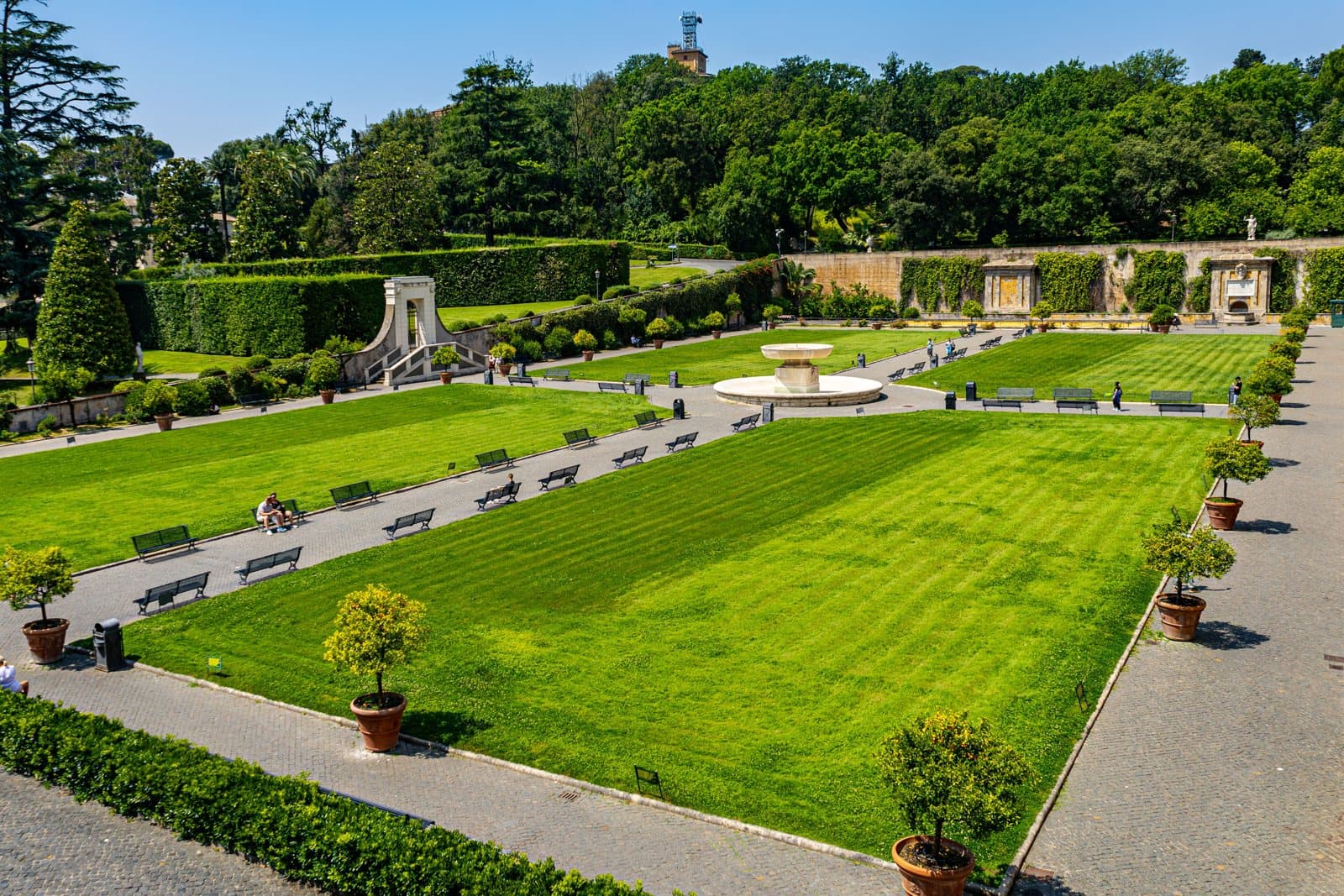Vatican Museums: the lawns and fountain of the Square Garden in summer sun